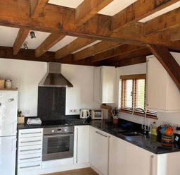 A kitchen with appliances and utensils at Tremail near Camelford