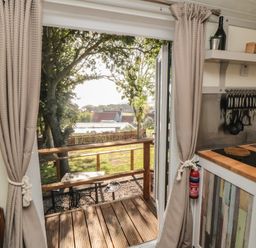 A kitchen with an outdoor view at Owls Roost in Robin Hood’s Bay