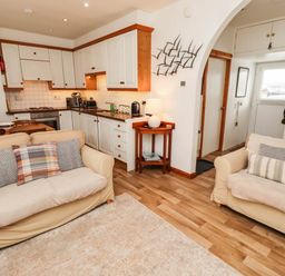 A kitchen with seating area in an open layout at Spinnaker