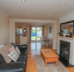 A living room with a sofa and coffee table at The Cosy Haven in Malton