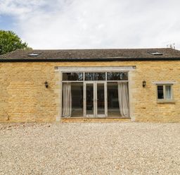 A stone building with large windows at Wayside in Moreton-in-Marsh