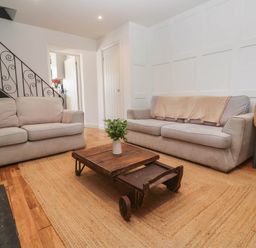 A living room with sofas and a coffee table at The Lookout in Redruth