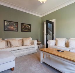A living room with a sofa and coffee table at Lansdowne Grange in Bridlington