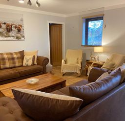 A living room with a sofa and armchairs at Blairgowrie Luxury 3 Bed Lodge with Hot Tub in Blairgowrie