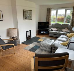 A living room with seating and television at House Sleeps 8 Close to Beach Free parking, Mullion
