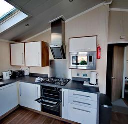 A kitchen with appliances and cabinets at Dunoon 3Bed Lodge Sleeps 6 Pet Friendly Near Dunoon