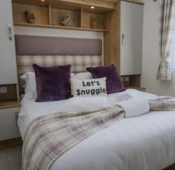 A bedroom with a bed and pillows at Lakeland Lodge 3Bed 2 Bath Private Patio in Carnforth