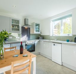 A kitchen with a table and chairs at 1Bed Coastal Retreat Sleeps 2 Parking Wifi in Bude