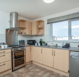 A kitchen with appliances and utensils at Spacious 3 Bed House Sleeps 6 Parking Wifi in Newquay