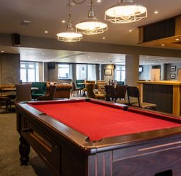 A game room with a pool table and seating areas at 2Br Lodge Pool Fireplace PetsOK Parking Goonhavern