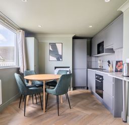 A kitchen with a table and chairs at 1 Bedroom Apartment Sleeps 2 Pets Welcome in Carbis Bay