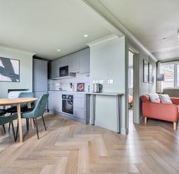 A kitchen with a dining table and chairs at 1 Bedroom Apartment Sleeps 2 Pets Welcome in Carbis Bay