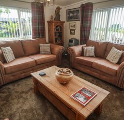 A living room with two sofas and a coffee table at The Hideaway at Monterey Helston