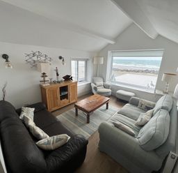 A living room with furniture and a view at Y Glyn in Borth