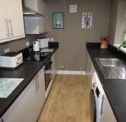 A kitchen with appliances and countertops at Brinkburn House in Scarborough