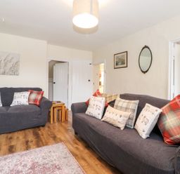 A living room with sofas and a coffee table at Irt Cottage in Seascale