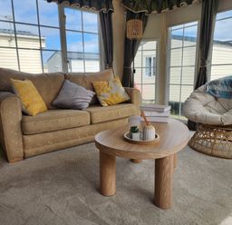 A living room with a sofa and a coffee table at Whitley bay parkdean resorts - 52 Beechfield, Whitley Bay