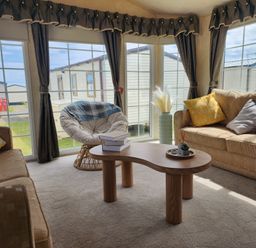 A snug with seating area and large windows at Whitley bay parkdean resorts - 52 Beechfield, Whitley Bay