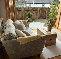 A living room with a sofa and coffee table at Old Chapel of Ermington Converted Vestry, Ermington