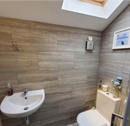 A bathroom with a sink and toilet at 3 Bedroom Cottage Hot Tub Garden Parking Dunkeswell