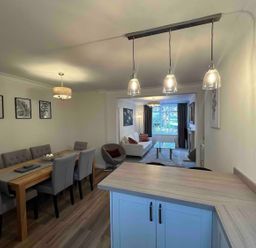 A dining room with a table and chairs visible at Charming 3Bed Cottage Private Garden Parking Torquay