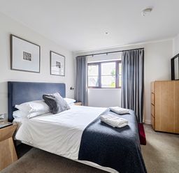A bedroom with a bed and window at 2bed sleeps4 pool freeparking Trenythonestate Near Par