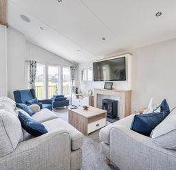 A living room with a sofa and armchairs at Atlantic Breeze Luxury Lodge sleep 6 Mullacott near Ilfracombe