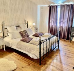 A bedroom with a bed and nightstands at Stunning Sleeps 6 Luxury Lodge Pets Mercia Marina near Willington, Derbyshire