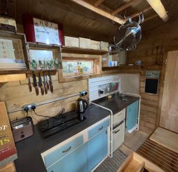 A kitchen with a sink and cabinets at 
