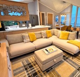 A living room with a sofa and coffee table at the property in unspecified location