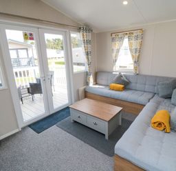 A living room with a sofa and coffee table at 14 Pines Cayton Bay