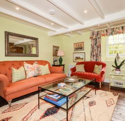 A living room with sofas and a coffee table at The Homestead in 