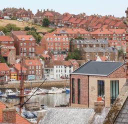 A view of houses and boats in Whitby Harbor at 14 Brunswick Street Whitby