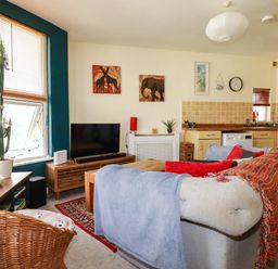 A living room with a sofa and television at Seaside Retreat in Newquay
