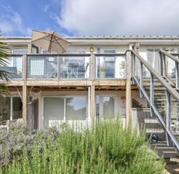 An outdoor balcony with furniture at Torpoint Apartment Sleeps4 Seaside Parking in Downderry