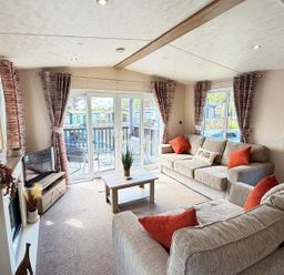 A living room with a television and sofa at Lillardsedge Luxury Caravan Sleeps 6 with Parking Lilliardsedge Holiday Park near St Boswells