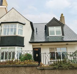 A house with varied windows and a front door at 11 Bryn Goleu Avenue North Holyhead