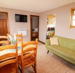 A dining area with table and chairs at Chalet 242 Carmarthen Bay Kidwelly