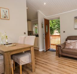 A dining room with a table and chairs at Fir Tree Lodge in White Cross bay on Windermere, Troutbeck Bridge