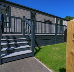 A property exterior with stairs and number 9 sign at Lakewood Plot 9 St. Osyth