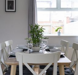A dining room with a table set for meals at East House-Sleeps 5-Pet friendly-Garden-Parking in Stakeford