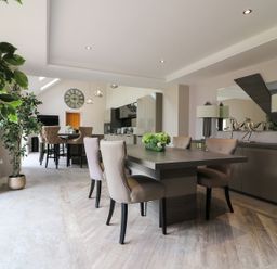 A dining room with a large table and chairs at Northumberland Luxury Stays - The Chivits near Amble