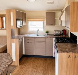 A kitchen with a sink and appliances at Seaside Tranquility Retreat in Clacton