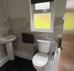 A bathroom with sink and toilet at Pet Friendly 2-Bed Lodge, Sleeps 5, Pool & Parking, Caernarfon