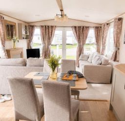 A living room with a dining table and sofa at Tattershall Lakes - Hot Tub - Sleeps 6 - Pets in Tattershall