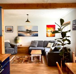 A living room with a sofa and coffee table at Ty Marlyn in St Davids