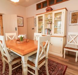 A dining room with a table and chairs at Myrtle Cottage in Lynmouth