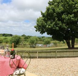 An outdoor area with a table and chairs at Beech Cottage in Truro