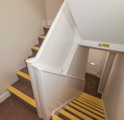 A staircase leading to a door at Flat 5 in Tenby