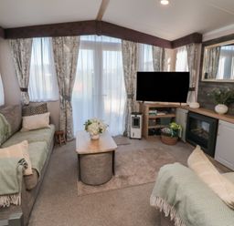 A living room with sofa and television at 19 Finch